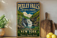 A vintage-style sign for Pixtley Falls State Park, featuring a waterfall surrounded by lush greenery and a blue sky with clouds.