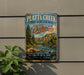 A vintage-style metal sign for Platte Creek State Recreation Area in South Dakota, featuring a scenic landscape with a river and mountains.