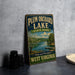 A vintage-style sign for Plum Orchard Lake State Park in West Virginia, featuring a scenic image of the lake and surrounding landscape.