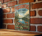 A vintage-style metal sign for POCAHONTAS State Park in Virginia, featuring a scenic landscape with a river, trees, and a deer.