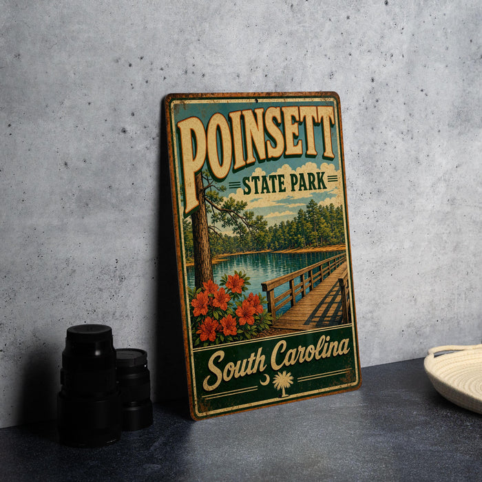 A vintage-style metal sign for Poinsett State Park in South Carolina, featuring a scenic landscape with a lake, bridge, and flowers.