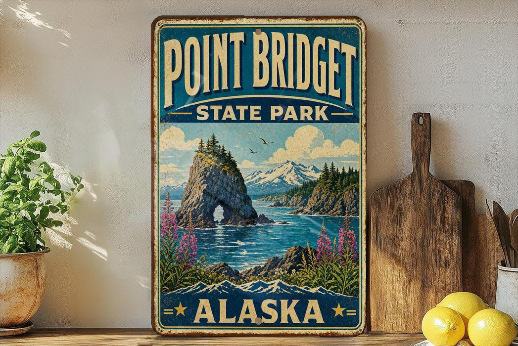 A vintage-style sign for Point Bridget State Park in Alaska, featuring a scenic landscape with mountains, water, and a rocky island.