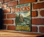 A vintage metal sign for Point of Rocks State Park in Maryland, featuring a scenic illustration of a mountain landscape with a river flowing through it.