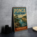 A vintage-style metal sign for Pona State Park in Nebraska, featuring a scenic landscape with a river and mountains.