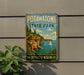 A vintage metal sign for Potawatomi State Park in Wisconsin, featuring a scenic image of a cliff overlooking a lake with a sailboat.