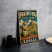 A vintage metal sign for Prairie Dog State Park in Kansas, featuring an illustration of a prairie dog in a grassy field with mountains in the background.