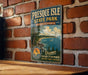 A vintage-style metal sign for Presque Isle State Park in Pennsylvania, featuring a scenic image of the park's shoreline and lighthouse.