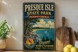 A vintage-style sign for Presque Isle State Park in Pennsylvania, featuring a scenic image of the park and its surroundings.