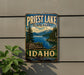 A vintage-style sign for Priest Lake State Park in Idaho, featuring a scenic mountain landscape with a lake and pine trees.