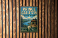 A vintage metal sign for Prince Gallitzin State Park, featuring a scenic landscape with a cabin and a lake.