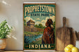 A vintage-style poster of Prophetstown State Park in Indiana, featuring a Native American figure in traditional clothing standing in front of a wooden structure.