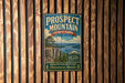 A vintage-style metal sign for Prospect Mountain State Park in New York, featuring a scenic mountain landscape and the text "Prospect Mountain State Park New York" along with the date "2:30".
