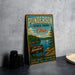 A vintage metal sign for Punderton State Park in Ohio, featuring a scenic lake and pine trees, is displayed on a gray concrete surface.
