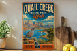 A vintage-style metal sign for Quail Creek State Park in Utah, featuring a scenic mountain landscape with a bird perched on a rock.