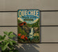 A vintage-style metal sign for Quechee State Park in Vermont, featuring a scenic image of a waterfall and a red wooden bridge.