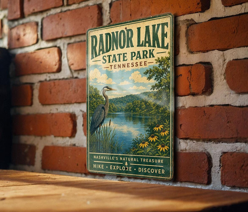 A vintage-style metal sign for Radnor Lake State Park in Tennessee, featuring a scenic illustration of the lake and surrounding landscape.