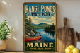 A vintage-style metal sign for Range Ponds State Park in Maine, featuring a scenic image of a lake, mountains, and a canoe.