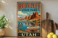 A vintage-style sign for Red Fleet State Park in Utah, featuring a scenic image of a boat on a lake surrounded by mountains.