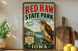 a vintage-style sign for Red Haw State Park, with a large eagle perched on a tree branch in the background. The sign is surrounded by various kitchen items, such as a cutting board, a knife, and a bowl of fruit, including lemons.