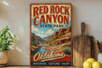 A vintage-style sign for Red Rock Canyon State Park in Oklahoma, featuring a scenic illustration of the canyon landscape.