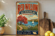 A vintage-style sign for the Red Willow State Recreation Area in Nebraska, featuring a scenic landscape with a sailboat on a lake.