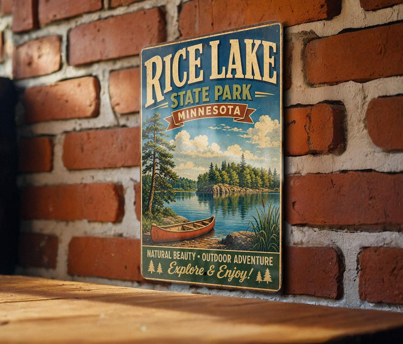 A vintage-style metal sign for Rice Lake State Park in Minnesota, featuring a scenic illustration of a lake, canoe, and forest.