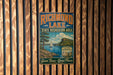 A vintage-style sign for Richmond Lake, a state recreation area in South Dakota, featuring a scenic landscape with a lake, mountains, and a sailboat.