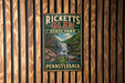 A vintage-style metal sign for Ricketts Glen State Park in Pennsylvania, featuring a waterfall and forest scenery.
