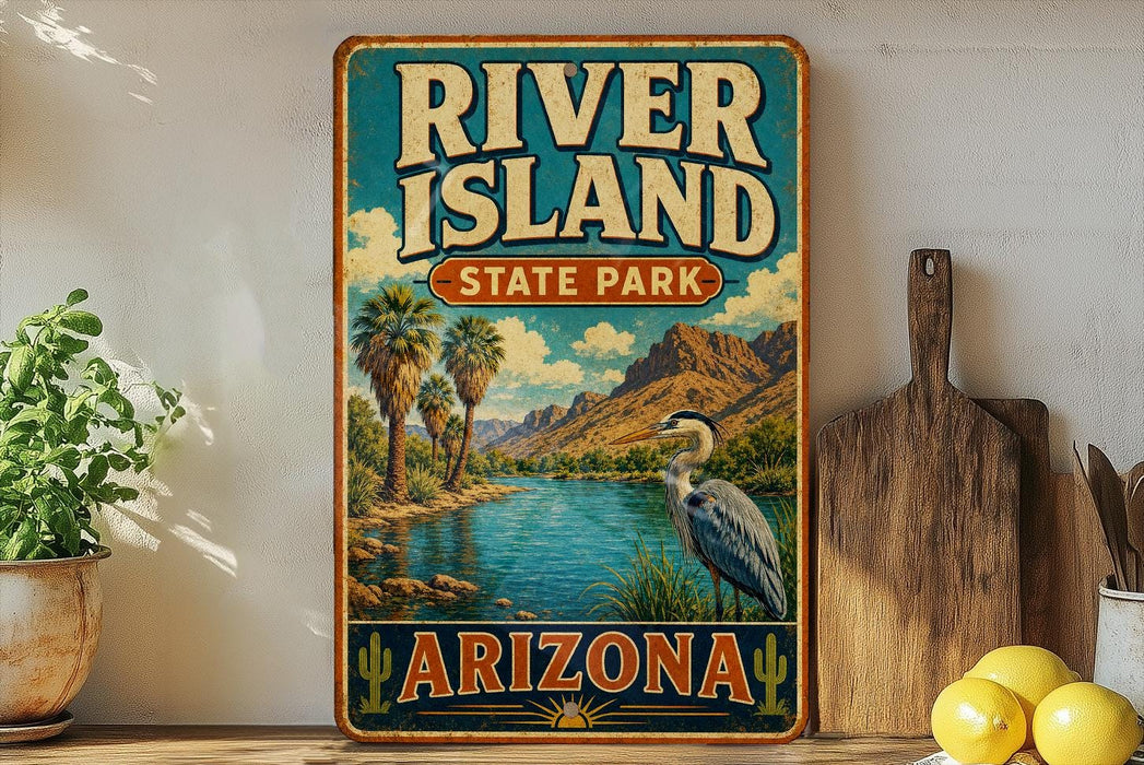 A vintage-style sign for River Island State Park in Arizona, featuring a scenic landscape with palm trees, mountains, and a heron.