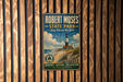 A vintage-style metal sign for Robert Moses State Park in Long Island, New York, featuring a lighthouse and beach scene.