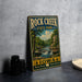 A vintage-style sign for Rock Creek State Park in Iowa, featuring a scenic landscape with a waterfall and trees.
