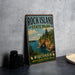 A vintage-style sign for Rock Island State Park in Wisconsin, featuring a scenic landscape with a lake, cliffs, and pine trees.