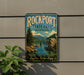A vintage-style sign for Rockport State Park in Washington, featuring a scenic landscape with a bridge, mountains, and a river.