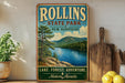 A vintage-style metal sign for Rollins State Park in New Hampshire, featuring a scenic image of a lake surrounded by pine trees and mountains.
