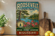 A vintage-style sign for Roosevelt State Park, featuring a scenic landscape with a river, pine trees, and pink flowers.