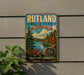 A vintage metal sign for Rutland State Park in Massachusetts, featuring a scenic landscape with pine trees, a lake, and autumn foliage.