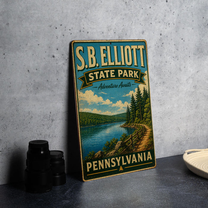 A vintage-style sign for S.B. Elliott State Park, featuring a scenic landscape with a lake and forest.