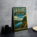 A vintage-style sign for S.B. Elliott State Park, featuring a scenic landscape with a lake and forest.