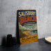 A vintage metal sign for Salisbury Beach, Massachusetts, advertising a state beach resort with a beach, sand, and sea theme.
