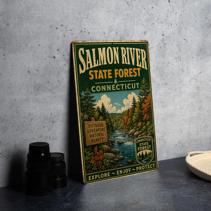 A vintage-style sign for the Salmon River State Forest in Connecticut, featuring a scenic illustration of the forest and a river.