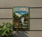 A vintage-style metal sign for Salt Springs State Park in Pennsylvania, featuring a scenic image of a waterfall surrounded by nature.