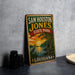 A vintage-style sign for Sam Houston Jones State Park in Louisiana, featuring a scenic illustration of a lake, trees, and a bird.
