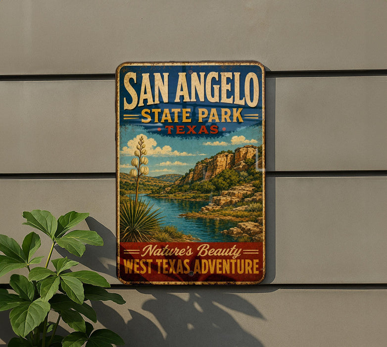 A vintage-style metal sign for San Angelo State Park in Texas, featuring a scenic landscape with a river and mountains.