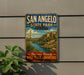 A vintage-style metal sign for San Angelo State Park in Texas, featuring a scenic landscape with a river and mountains.