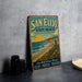 A vintage-style metal sign for San Elijo State Beach, California, featuring a beach scene with a sunset, palm trees, and a lifeguard tower.