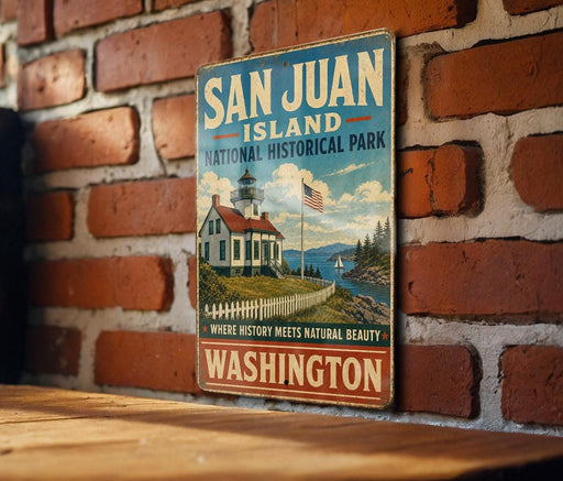 A vintage-style metal sign for San Juan Island National Historical Park in Washington, featuring a lighthouse and a scenic landscape.