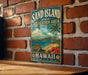 A vintage-style metal sign for the "Sand Island State Recreation Area" in Hawaii, featuring a beach scene with a palm tree, ocean, and a turtle.