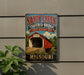 A vintage-style metal sign for the Sandy Creek Covered Bridge in Missouri, featuring an illustration of a covered bridge and the text "Sandy Creek Covered Bridge State Historic Site Missouri".