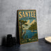 A vintage-style metal sign for Santee State Park in South Carolina, featuring a scenic illustration of a bird, a boat, and a river surrounded by trees.
