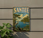 A vintage-style sign for Santee State Park in South Carolina, featuring a serene landscape with a crane, palm trees, and a river.